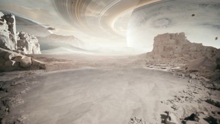 a group of people standing on top of a desert covered in rocks and sand next to an alien like structure