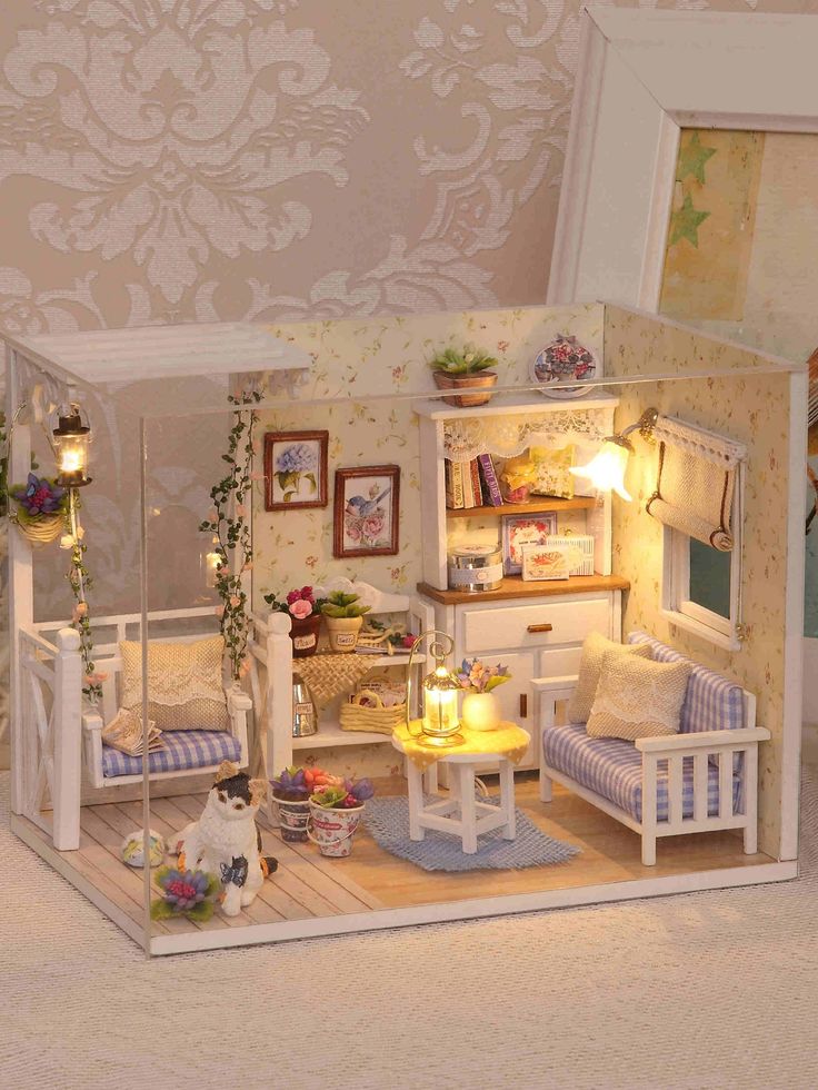 a doll house with furniture and flowers in it