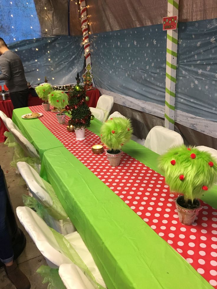 the table is decorated with green and red decorations