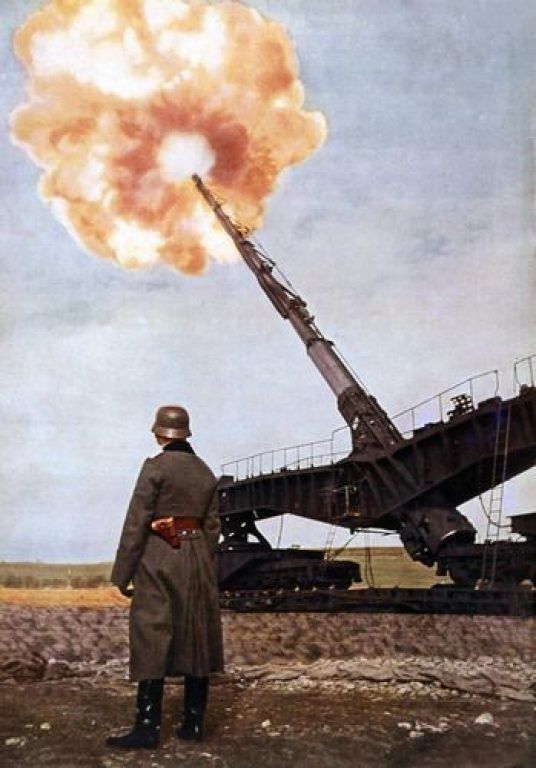 a man standing in front of a large bomb