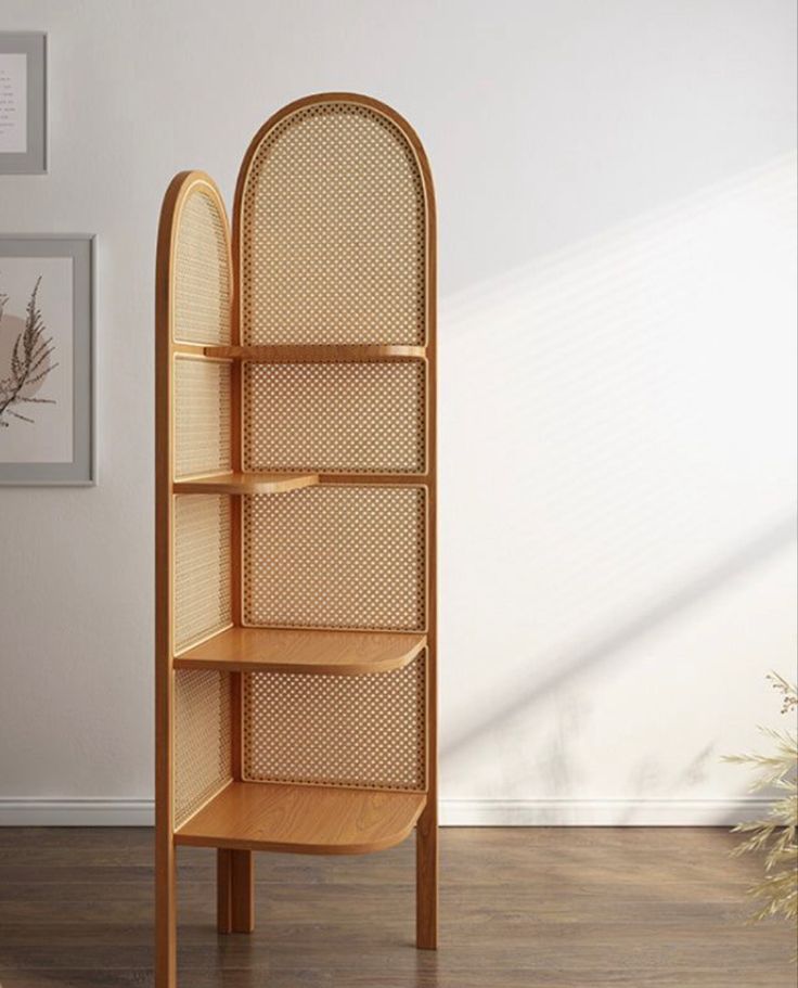 a wooden shelf sitting on top of a hard wood floor next to a white wall