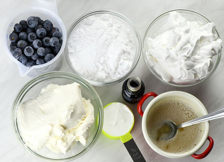 the ingredients to make blueberry cheesecake are in bowls