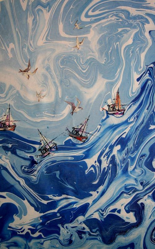 two boats floating on top of a blue and white swirled ocean with birds flying over them