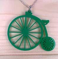 a green necklace with a wheel on it