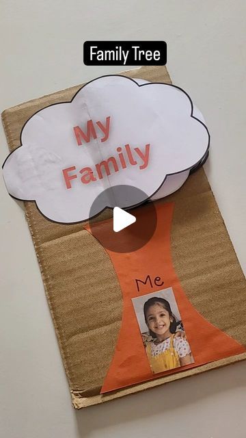 a paper bag with an image of a child's face on it and the words, my family