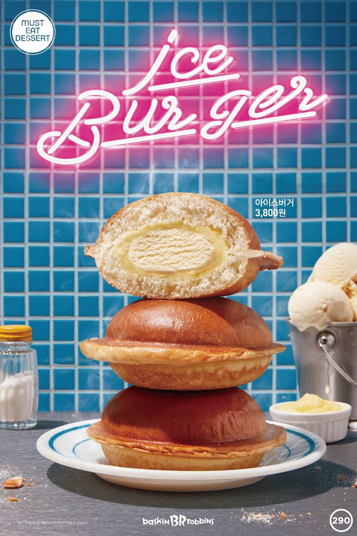 a poster advertising ice cream on a blue tiled wall with food in the foreground