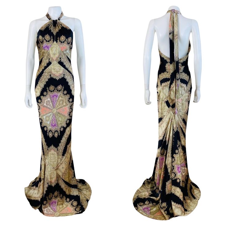 Vintage 2000s Roberto Cavalli Dress Black silk with purple, coral + cream accents throughout Abstract paisley print + metallic gold painted look accents High halter style neckline with long fabric sashes that tie at the back of the neck Fitted bodice with keyhole cut out Fitted mermaid style Flattering bias cut Maxi length w/mermaid hem Low cut open upper back Bustle look train at the back Unlined Hidden zipper up the back Marked M, Measurements - Underarm to underarm 16-18" , Waist - 13-14", Hi Gold Halter Dress, Gown Mermaid, Abstract Paisley, Roberto Cavalli Dress, Cavalli Dress, Purple Coral, Silk Dressing Gown, Gabbana Dress, Mermaid Style