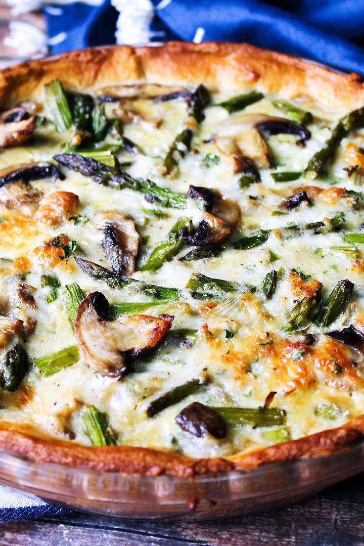 a quiche with asparagus, mushrooms and cheese