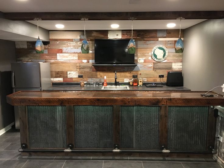 a kitchen with a wooden counter top next to a refrigerator freezer and microwave oven