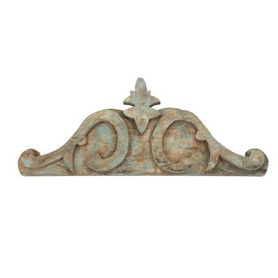 an old fashioned cast iron shelf with scrolls and stars on the top, against a white background