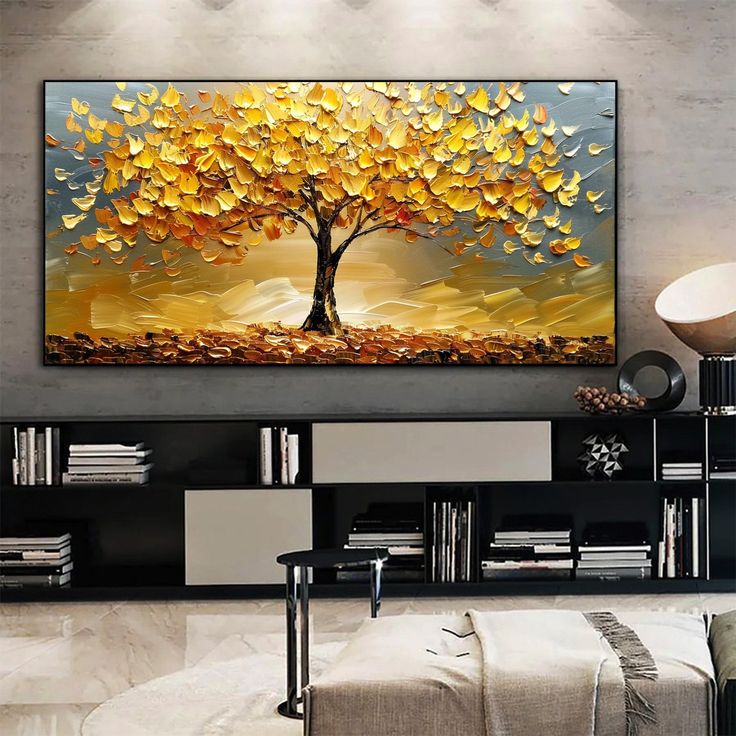 an abstract painting of a tree with yellow leaves on it's trunk in a living room