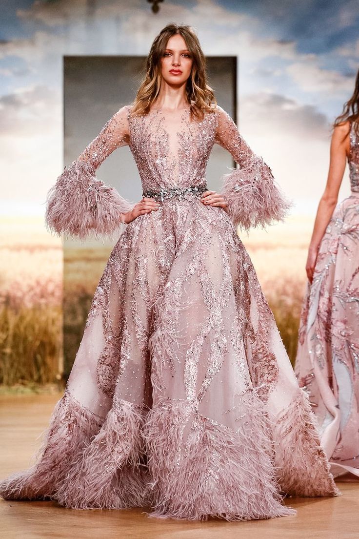 Wedding Trend Alert! Ostrich feather wedding dresses are currently all the rage - no wonder we are seeing so many celebs sport the look too! From intricate bodice appliques to romantic twirly skirts, this haute couture wedding inspiration is just what the doctor ordered. And in so much color! See our 35 favorite feather wedding dress styles on #ruffledblog now. Feather Wedding Dresses, Ziad Nakad Couture, Feather Wedding Dress, Wedding Dress With Feathers, Ziad Nakad, Couture Bridal Gowns, Feather Wedding, Spring Couture, فستان سهرة