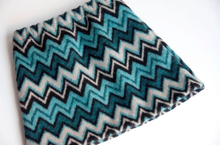 a blue and black zigzag pattern on a white background, with the fabric folded down