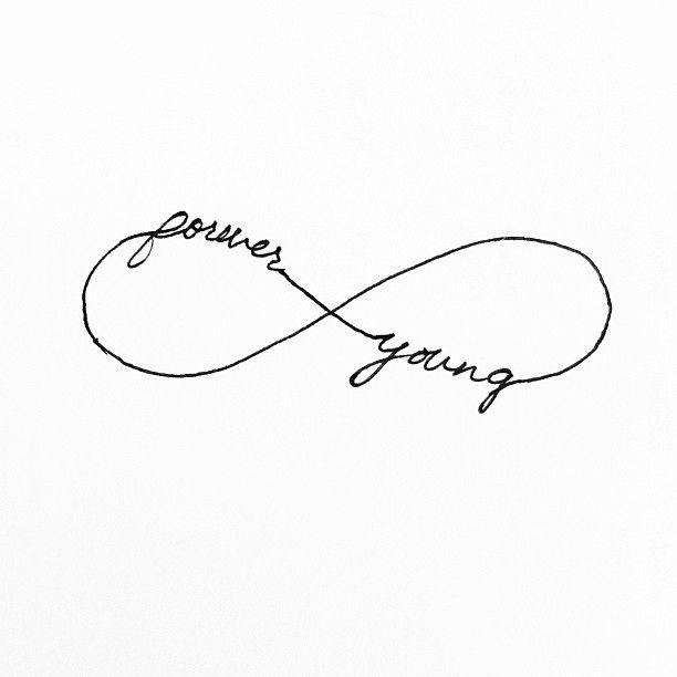 the word forever young written in cursive handwriting on a white paper with a black pen