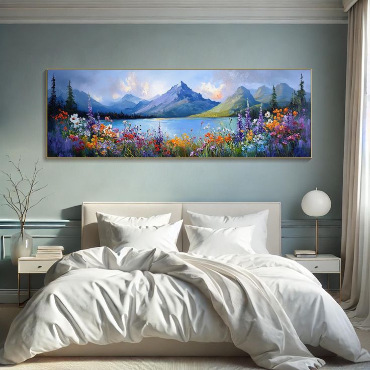 a large painting on the wall above a bed in a room with white sheets and pillows