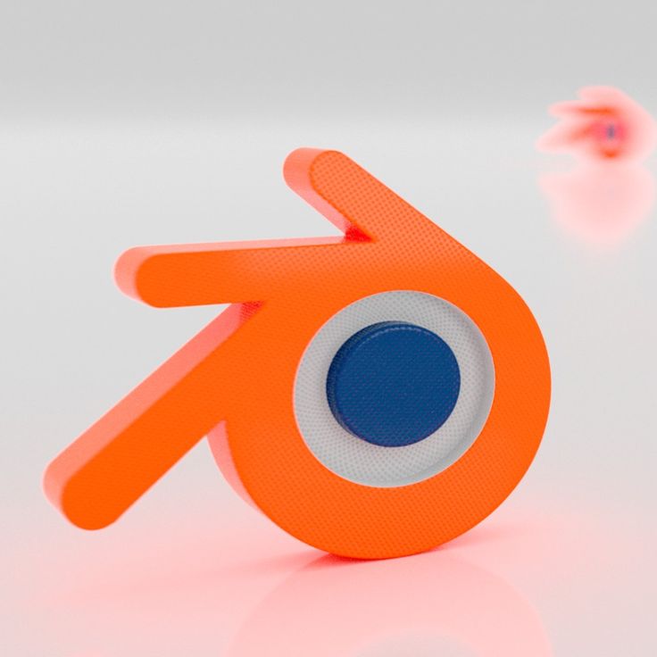 an orange object with a blue dot in the center on a white surface next to pink objects