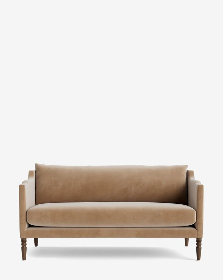 a tan leather couch against a white background