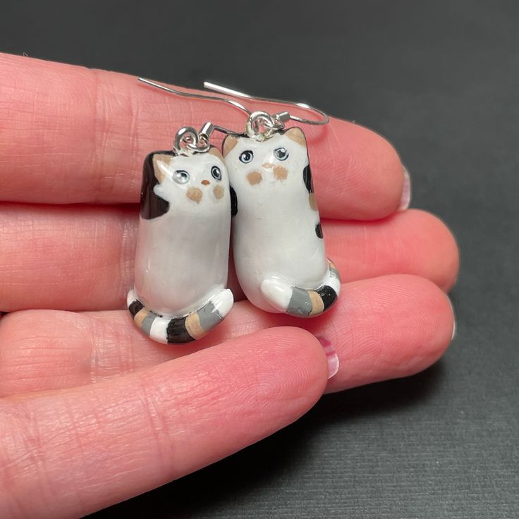 Looking for a fun and quirky gift? These cat earrings are sure to bring a smile to anyone's face!  Treat yourself or surprise a loved one with these charming cat-themed earrings today! Adorable cat earrings! Each pair is meticulously handcrafted with love and attention to detail, making them the perfect addition to your jewelry collection. Made from high-quality polymer clay, these earrings are lightweight and comfortable to wear, ensuring they become your new favorite accessory. Whether you're Clay Cat Earrings, Cat Themed, Cat Lover Gift, Quirky Gifts, Cat Earrings, Cat Theme, Cat Mom, Cat Lover Gifts, Cat Lover