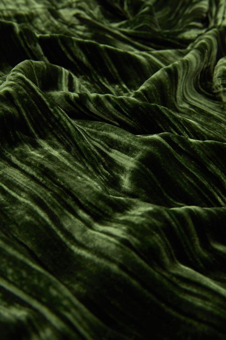 the green fabric is very soft and wavy, it looks like something out of space