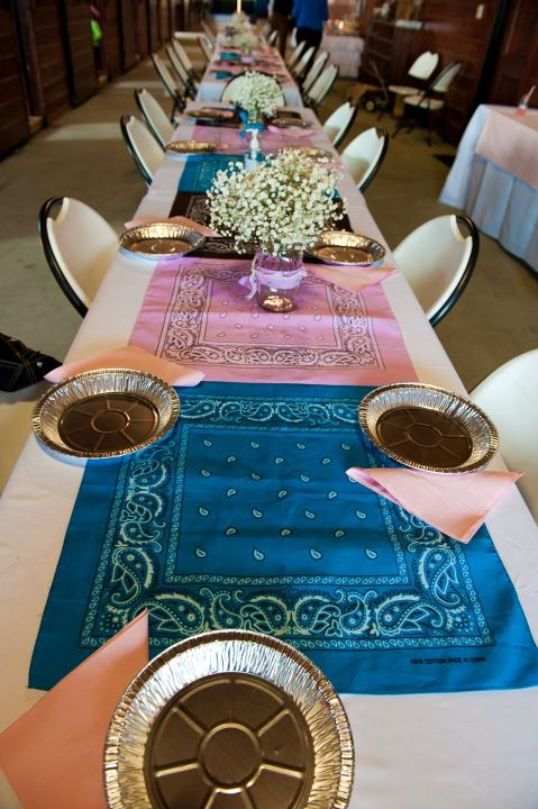 a long table set with place settings and napkins