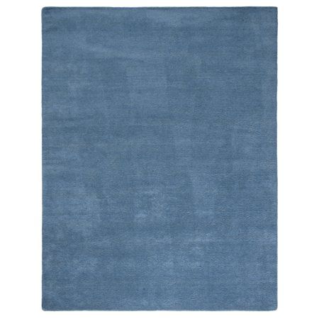 a blue rug on a white background with an area rug in the shape of a rectangle