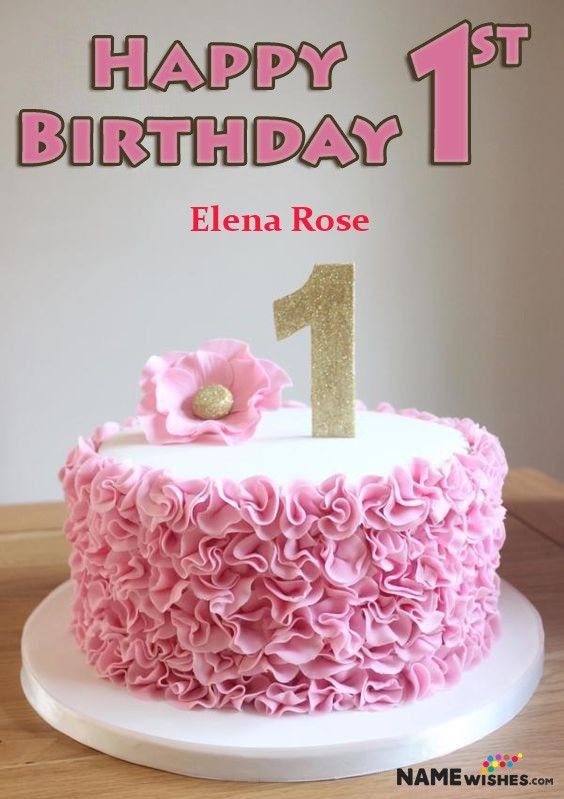 a birthday cake with pink ruffles and a gold number one on it's top