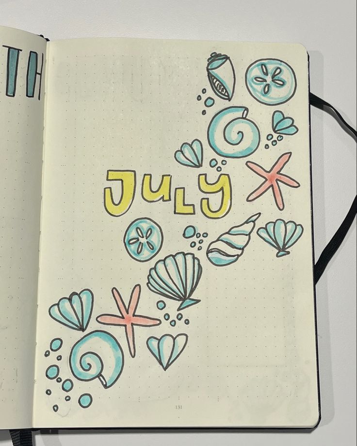 an open notebook with the word july written in it