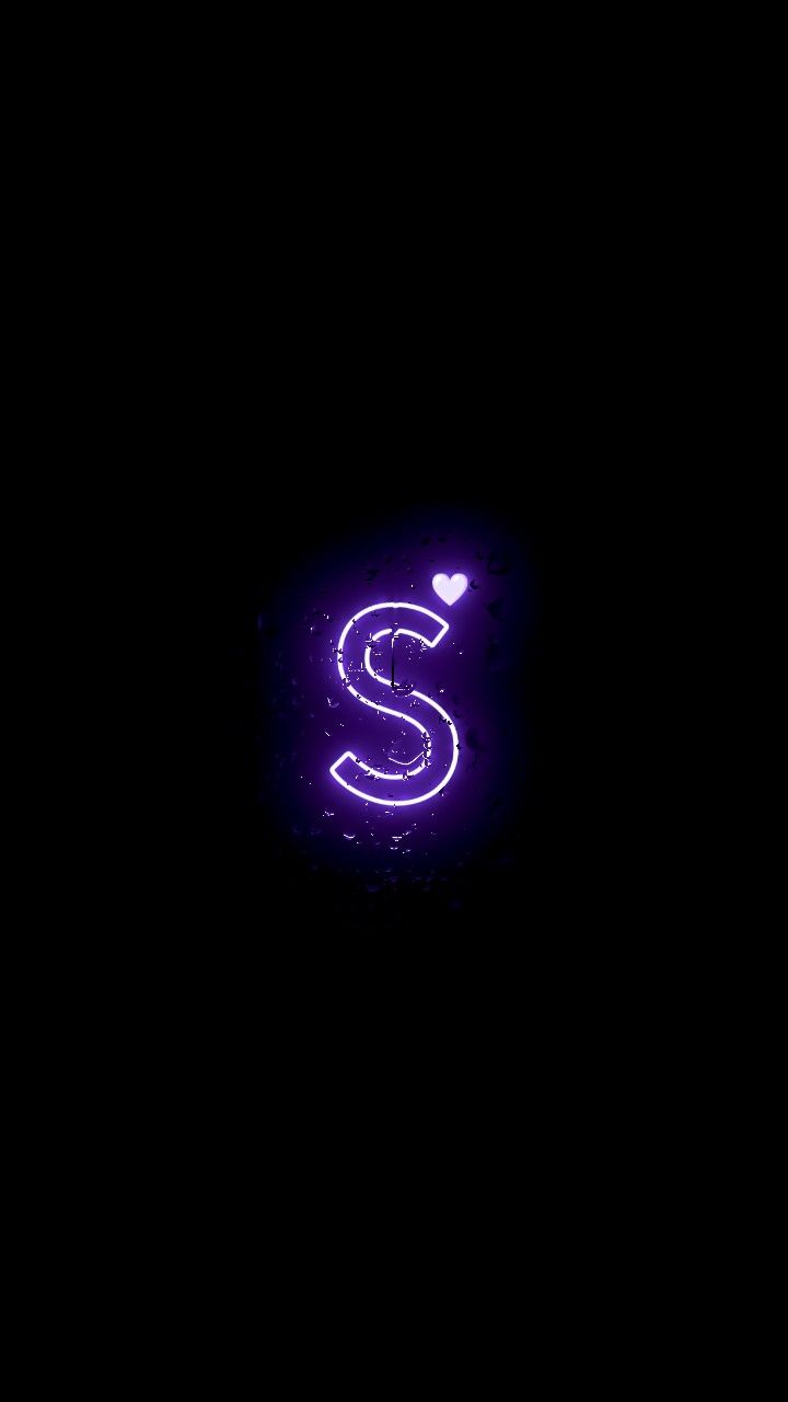 the letter s is illuminated in purple light