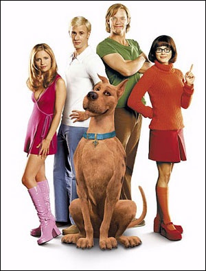 the scooby - doo movie poster is shown with four people and a dog