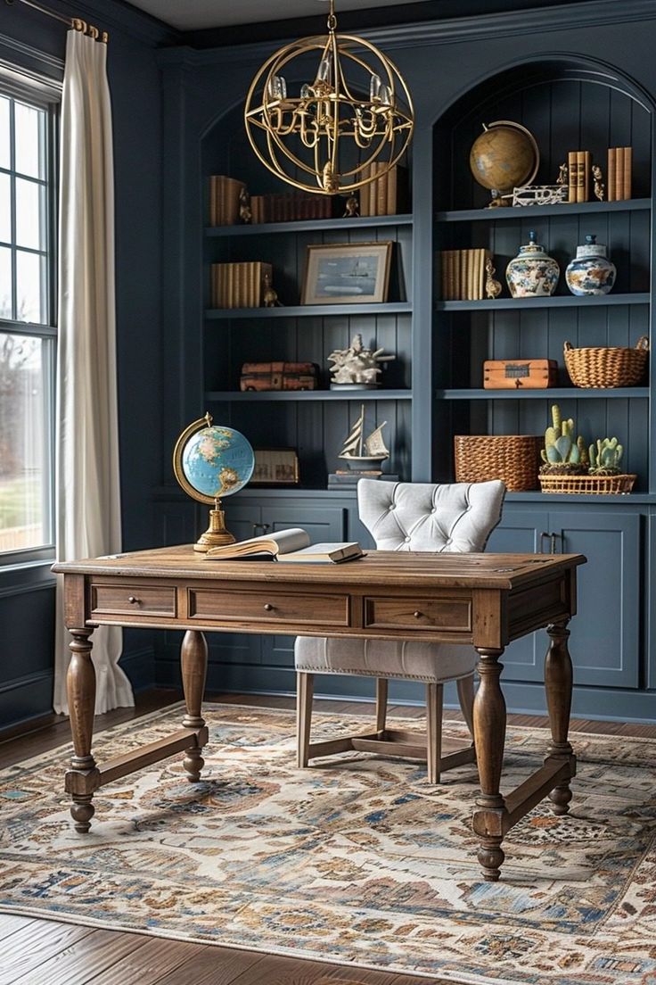 a room with blue walls and wooden furniture, including a desk in the center surrounded by bookshelves