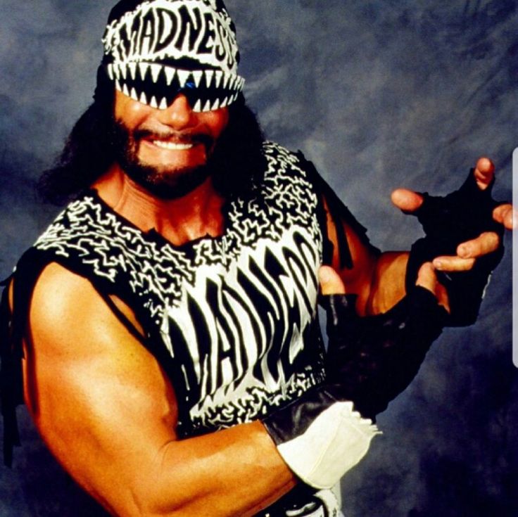 a man wearing a zebra print shirt and wrestling gloves