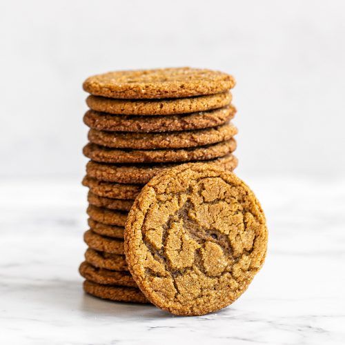 a stack of cookies sitting next to each other on top of a marble countertop