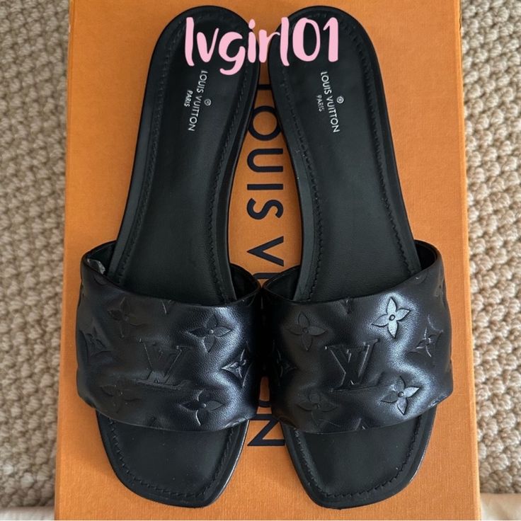 Beautiful Lambskin Empriente Mule Sandal By Louis Vuitton.Sold Out In Black. These Are In Excellent Used Condition.Gentle Wear. The Bottom Soles Show Signs Of Wear From Use. The Insoles Show Signs Of Light Wear. The Front And Back Sole Of Each Shoe Show Signs Of Gentle Wear.Scuff Marks From Use (See Pic’s). The Shoe Box Shows Signs Of Wear.Cracked (See Pic’s). Date Code Is Ma1200. Comes With The Original Shoe Box, 2 Dust Bags, And The Receipt. Poshmark Will Authenticate. Sorry.No Trades!! Mule Sandals, Louis Vuitton Shoes, Shoe Show, Shoe Box, Authentic Louis Vuitton, Mule, Women's Shoes Sandals, Shoes Sandals, Dust Bag