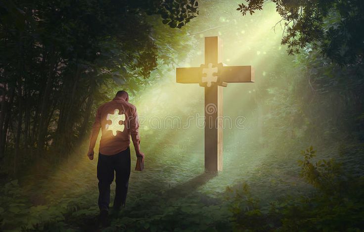 a man is walking towards a cross in the woods with sunlight streaming through it and shining on him