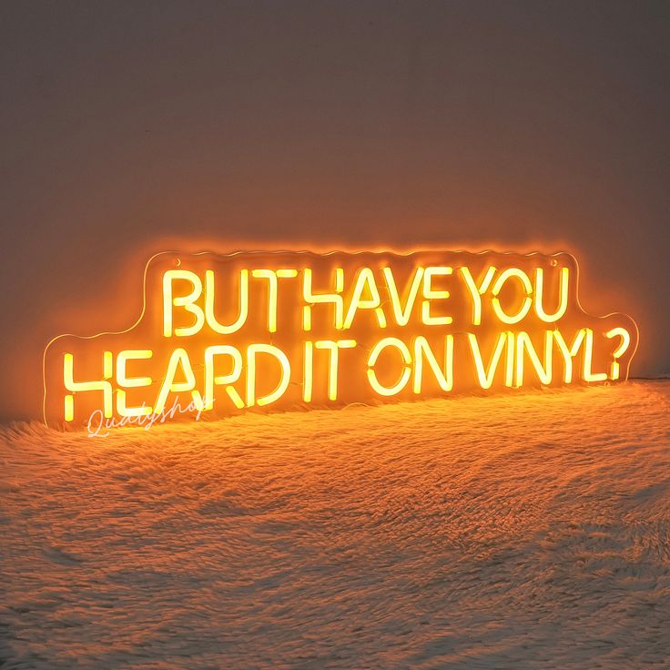 a neon sign that says, but have you heard it on vinyl?