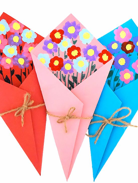 three envelopes with flowers on them tied together