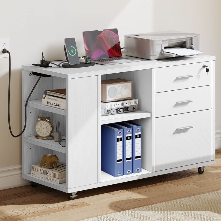 a computer desk with drawers and a printer on top of it next to a wall