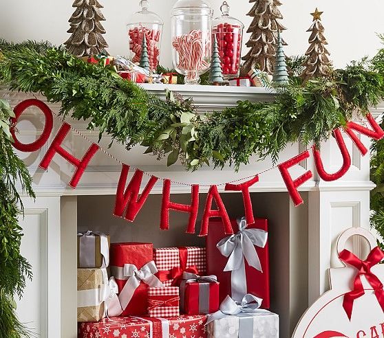 a mantel with christmas decorations and presents on it, along with the words what fun?