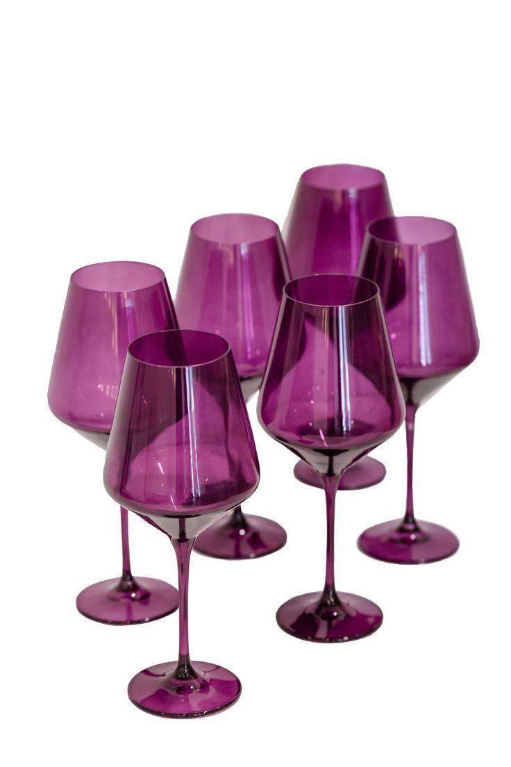 six purple wine glasses sitting next to each other