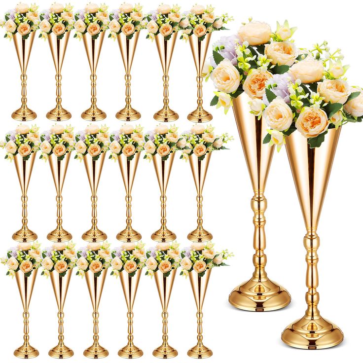 a bunch of gold vases with flowers in them