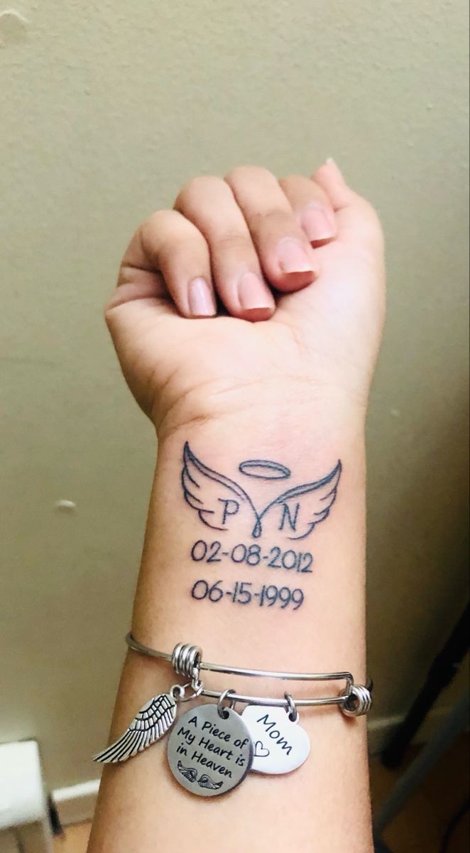 a woman's arm with two bracelets and an angel tattoo on the wrist