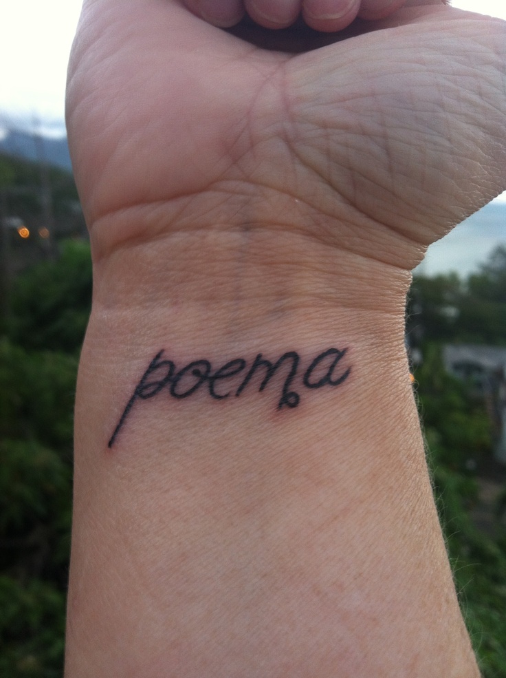 a person's wrist with the word peena written on it in cursive font