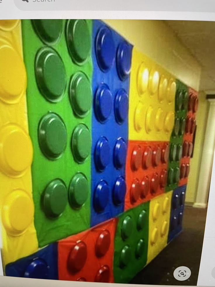 there is a colorful wall made out of legos