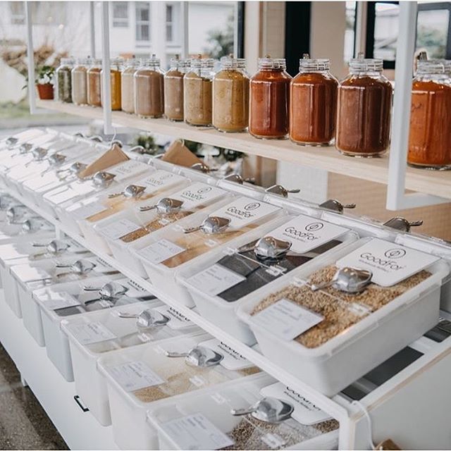 jars filled with different types of spices on shelves