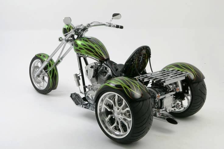 a green and black motorcycle is shown on a white background with the wheels turned down