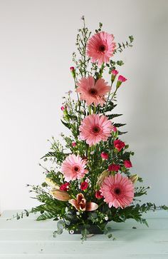 a flower arrangement is displayed on the phone