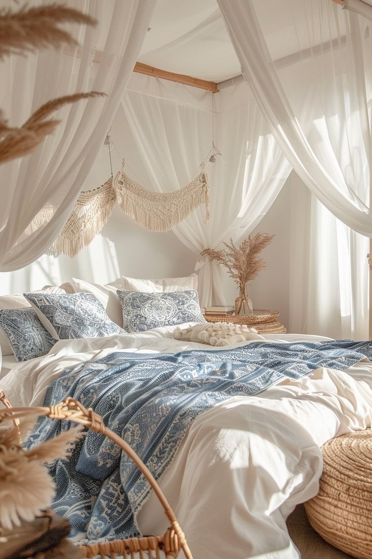 a bed with blue and white linens in a bedroom next to wicker baskets