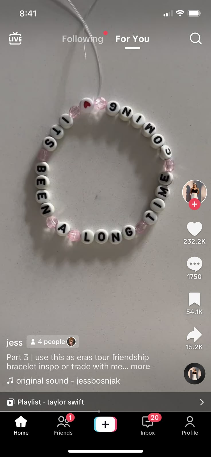 a beaded bracelet with the word love spelled in white letters and pink beads on it