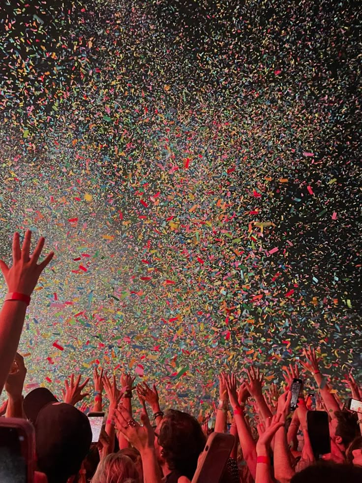 confetti is thrown in the air at a concert