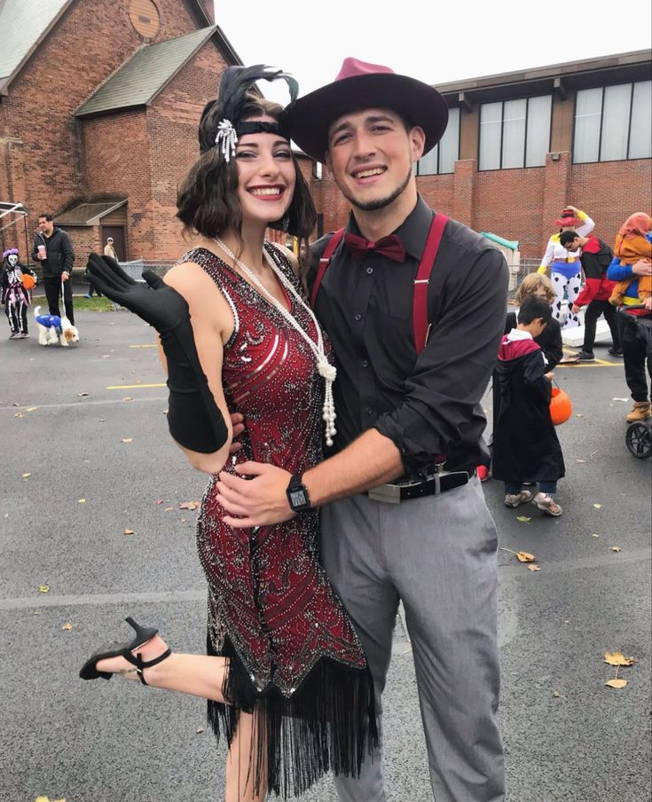 a man and woman dressed up in costumes